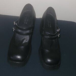 A pair of black Call It Spring Monroe Mary Jane pumps with a foot B.E.D size 8
